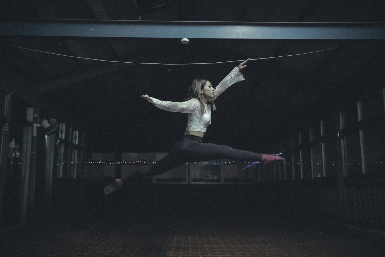 woman jumping inside room